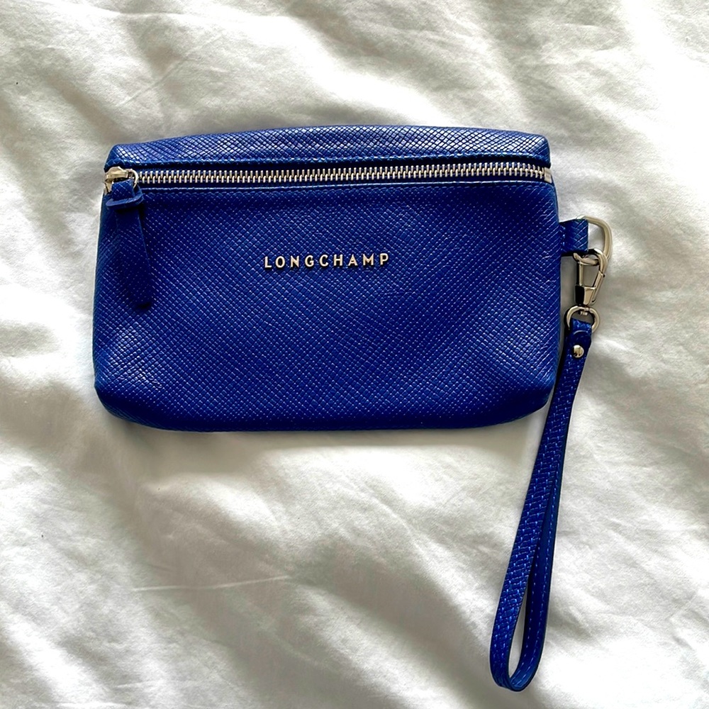 Longchamp blue leather wristlet with zipper.